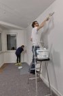 Young couple renovating new apartment — Stock Photo
