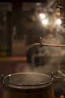 Cauldron of steaming Feuerzangenbowle traditional German alcoholic drink — Stock Photo