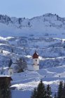 Austria, Vorarlberg, Bregenz Forest, St. Nicholas Church in winter — Stock Photo