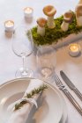 Place setting and decoration on festive laid table — Stock Photo