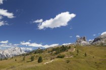 Italy, Veneto, Hiking trail at Falzarego Pass and Monte Averau under clouds — Stock Photo