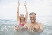Senior couple swimming in sea — Stock Photo
