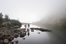 Austria, Styria, Man and woman walking near Lake Spiegelsee — Stock Photo