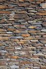 Shabby stone wall, full frame — Stock Photo