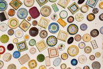 Variety of plates hanging on wall at pottery in Portugal — Stock Photo
