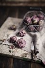 Fresh Baby artichokes and knife — Stock Photo