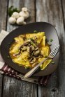 Ravioli with mushrooms on plate — Stock Photo