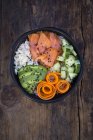 Sushi-Bowl with salmon, avocado, cucumber, rice and carrot — Stock Photo