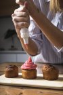 Woman preparing muffins at home — Stock Photo