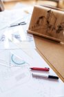 Blueprints and pens on an architect's desk — Stock Photo