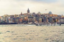Turkey, Istanbul, view to Galata Tower, Golden Horn and tourboat — Stock Photo
