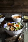 Lunch bowl, cooked egg, rice, smoked salmon, mushrooms, green cabbage, sesame — Stock Photo