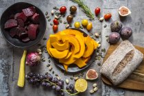 Pumpkin panzanella, bread salad of pumpkins, onions, tomatoes, grapes and figs — Stock Photo