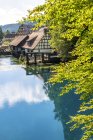 Germany, Baden-Wuerttemberg, Blaubeuren, Blautopf, hammer mill and Blau river — Stock Photo