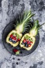 Sliced ananas with fruits, kiwi, strawberry and blueberry — Stock Photo