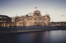 Germany, Berlin, Reichstag building at Spree river in the evening — Stock Photo