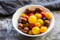 Bowl of mini tomatoes — Stock Photo