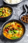 Red curry in bowls and roasted chickpeas — Stock Photo