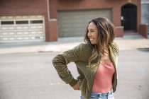 Happy young woman on the street — Stock Photo