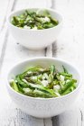 Green asparagus salad with helically coiled cucumber and feta cheese — Stock Photo