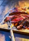Medium rare beefsteak on wooden board — Stock Photo