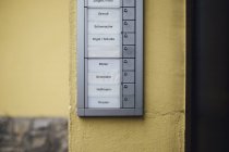 Germany, doorbell button panel with empty nameplate of deceased neighbour — Stock Photo