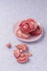Homemade meringue with dried rose blossoms — Stock Photo