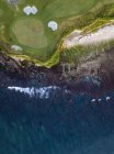 Indonesia, Bali, Aerial view of golf course with bunker and green at coast — Stock Photo