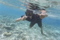 Indonesia, Bali, Young man snorkeling — Stock Photo