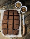 Homemade brownies on parchment paper — Stock Photo