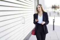 Portrait of businesswoman using cell phone — Stock Photo