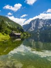 Austria, Styria, Altaussee, boathouse at Altausseer See with Trisselwand at in the background — Stock Photo
