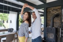 Happy couple dancing at home — Stock Photo