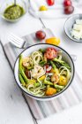 Spaghetti with shrimps, green asparagus, tomatoes, pesto and parmesan — Stock Photo
