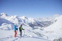 Austria, Tyrol, Kuehtai, two skiers in winter landscape — Stock Photo