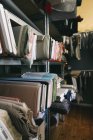 Assortment of cloth samples on shelf — Stock Photo