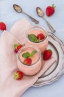 Two glasses of strawberry trifle with mascarpone cream and Amarettini — Stock Photo