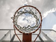 Basketball hoop against clouded c — Stock Photo