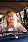 Portrait of young woman in a van — Stock Photo