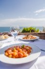 Italy, Atrani, plate of gnocchi with tomato sauce — Stock Photo