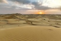 Iran, Isfahan Province, Varzaneh, Varzaneh Desert, Varzaneh sand dunes at sunset — Stock Photo