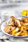 Classic english fish and chips with tartare sauce — Stock Photo