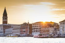 Italy, Venice, view from the lagoon towards St Mark's Square with Campanile at sunset — Stock Photo