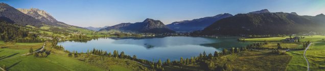 Austria, Tyrol, Kaiserwinkl, Aerial view of lake Walchsee, panorama — Stock Photo