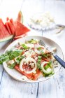 Watermelon salad with onions, feta and basil — Stock Photo