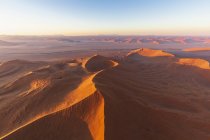 Africa, Namibia, Namib desert, Namib-Naukluft National Park, Aerial view of desert dunes in the morning light — Stock Photo