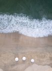 Indonesia, Bali, Aerial view of Jimbaran beach, white sunshades from above — Stock Photo