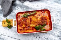 Tuscan pork fillet in gratin dish from above — Stock Photo