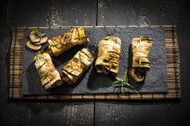Grilled aubergine slices stuffed with mince meat, champignons and goat cheese — Stock Photo