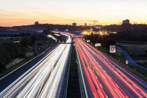 Germany, Baden-Wuerttemberg, Stuttgart, Autobahn A8 in the evening, light trails — Stock Photo